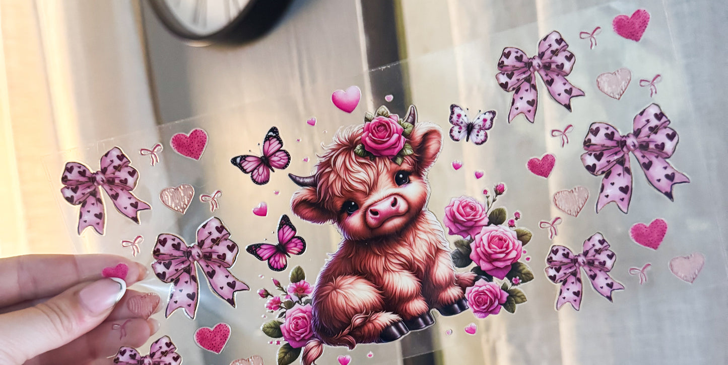 Cow with pink bows and butterflies